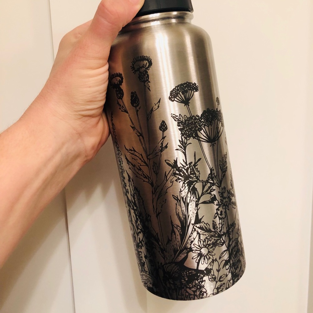 Laser engraved water bottle with wildflowers
